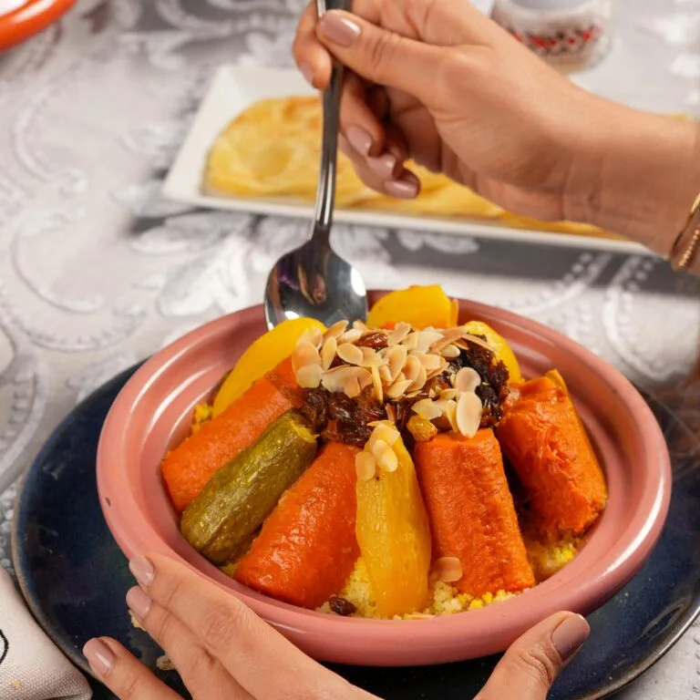 Moroccan couscous dish with vegetables at Riad Dar Chrifa, a traditional restaurant in Rabat.